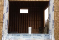 Sequence of proper window installation using self adhered membrane flashing, caulking and weather resistant barrier, new construction home